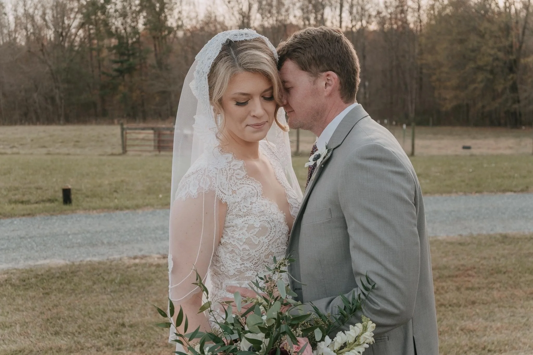 A couple on their wedding day having a stress-free loving embrace.