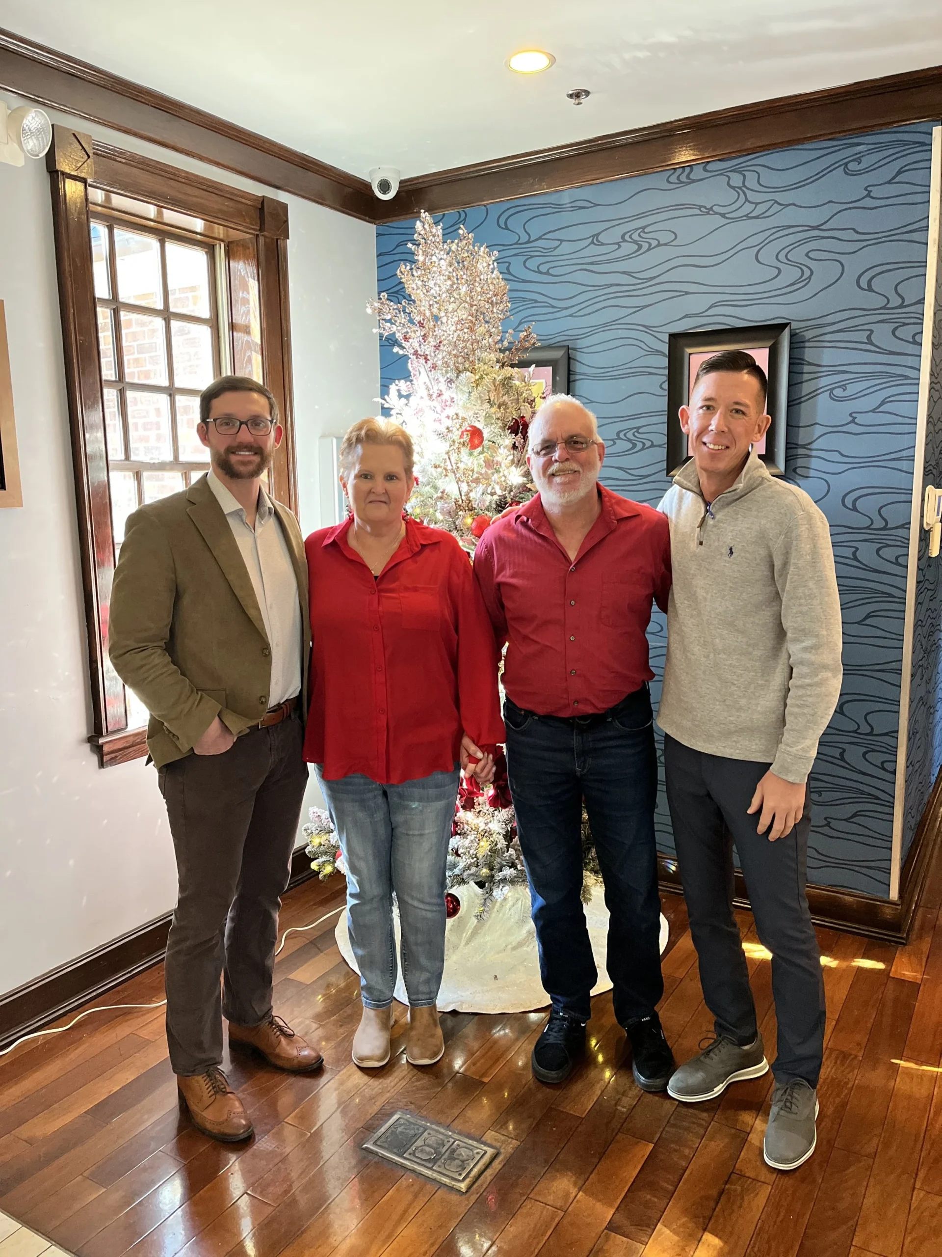  Rhonda and Michael with  Riverwalk Restaurant ’s owner and manager, Stephen and Syd, at their recent visit to the restaurant. 