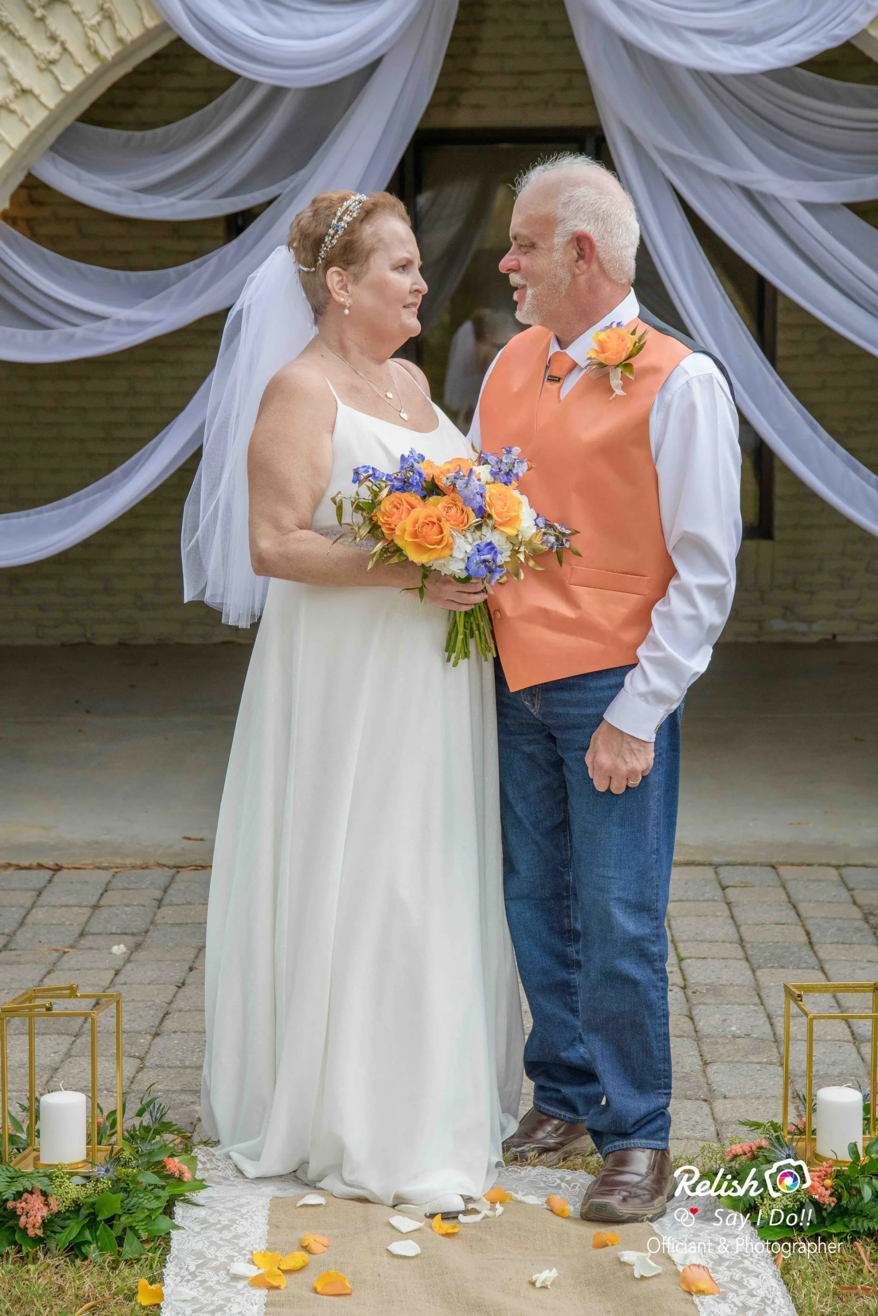  Rhonda and Michael at the altar, sharing a sweet moment together. Photographed by  Relish Say I Do! Officiant & Photographer.  