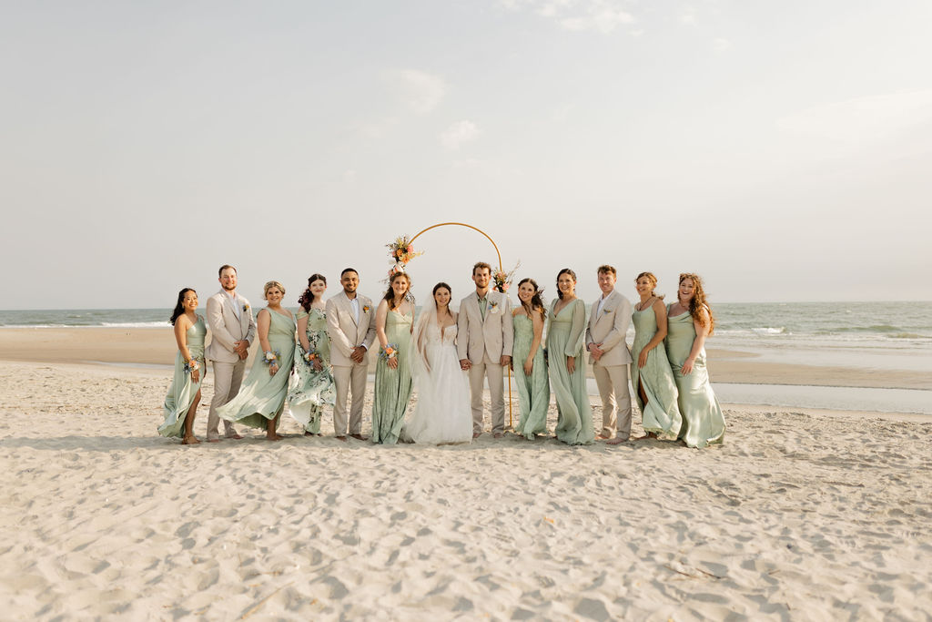 Beach wedding party photo for wedding planning package